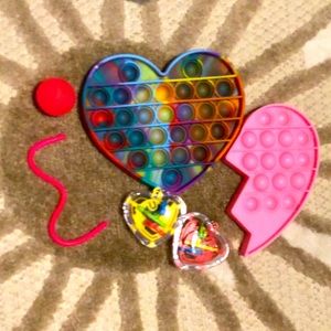Popits, mazes, a bouncy ball, and a mini monkey noodle! This is a heart bundle!